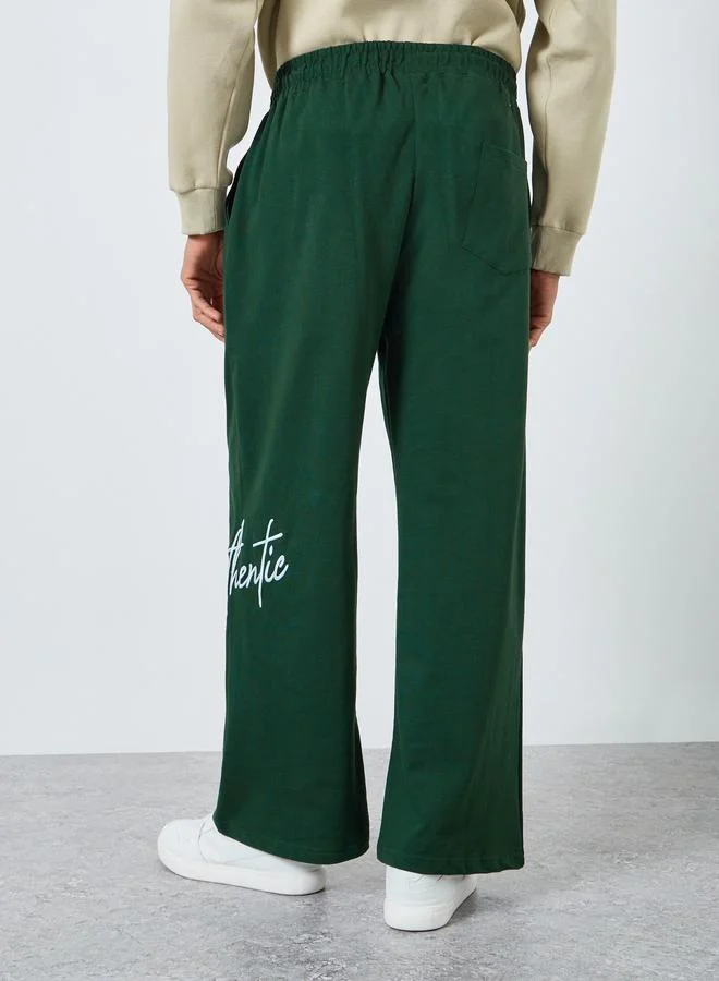 Styli Men Green Embroidered Joggers